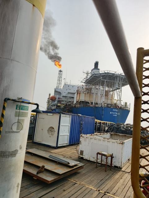 Steel plates on a support vessel deck beside FPSO Mystras